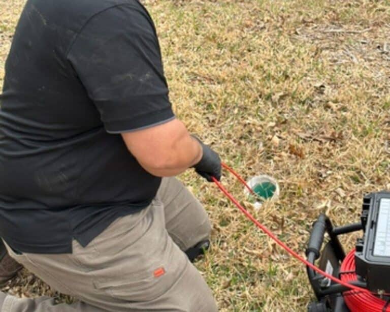 Person using equipment on the ground