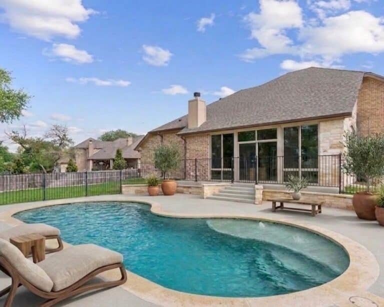 Backyard pool with modern landscaping.